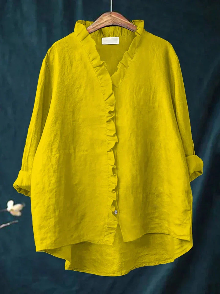 Elegant women's ruffle V-neck blouse with a relaxed fit. Stylish and comfortable casual top.