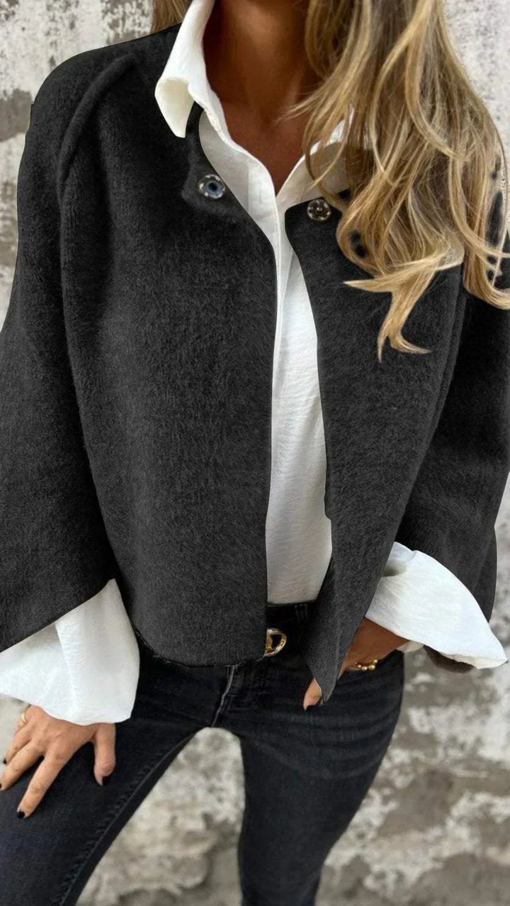 Chic women's spring coat, elegant & sophisticated. A classic long-sleeve layering piece for versatile fashion.