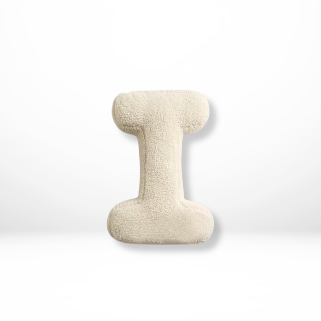 Plush velvet 'M' alphabet cushion, a decorative pillow for personalized home decor & soft furnishings.