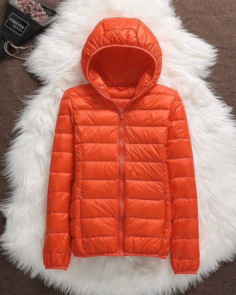 Modern women's lightweight waterproof jacket. Elegant all-weather coat offering comfort & versatile protection.