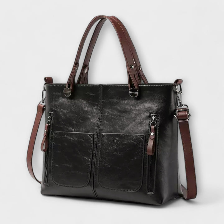 Timeless women's classic black leather shoulder bag, an elegant & versatile daily fashion accessory.