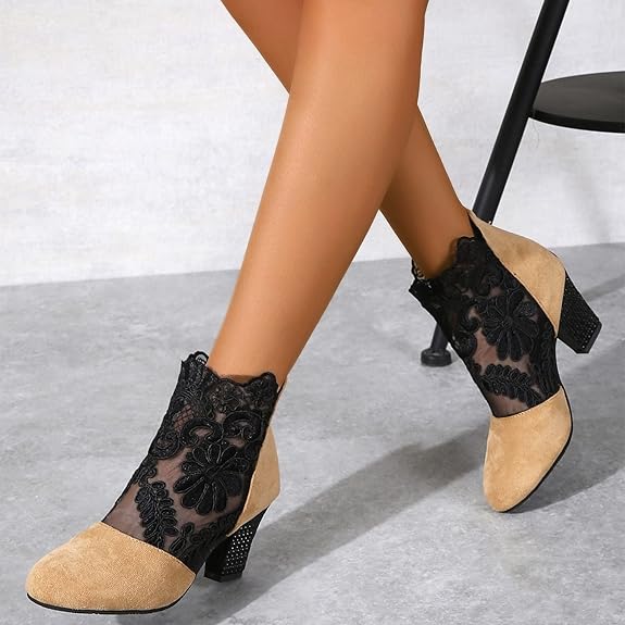 Model wearing elegant women's lace embroidered block heel ankle boots, perfect for fall and winter outfits.