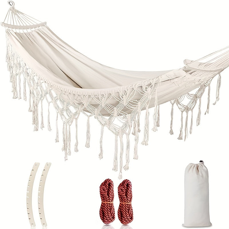 Bohemian tassel hammock, vibrant stripes, perfect for outdoor garden relaxation.