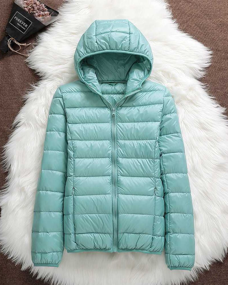 Durable women's lightweight waterproof jacket. Breathable all-weather coat for comfortable outdoor protection.