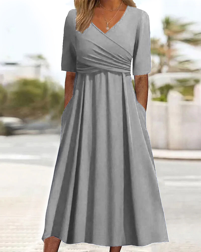 Sleeveless A-line midi dress for women in a stylish grey, featuring a V-neck & pockets. Great for warm weather.
