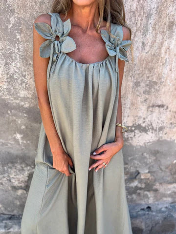 Chic women's long maxi dress with elegant bow straps & U-neck, a versatile flowing design for any occasion.