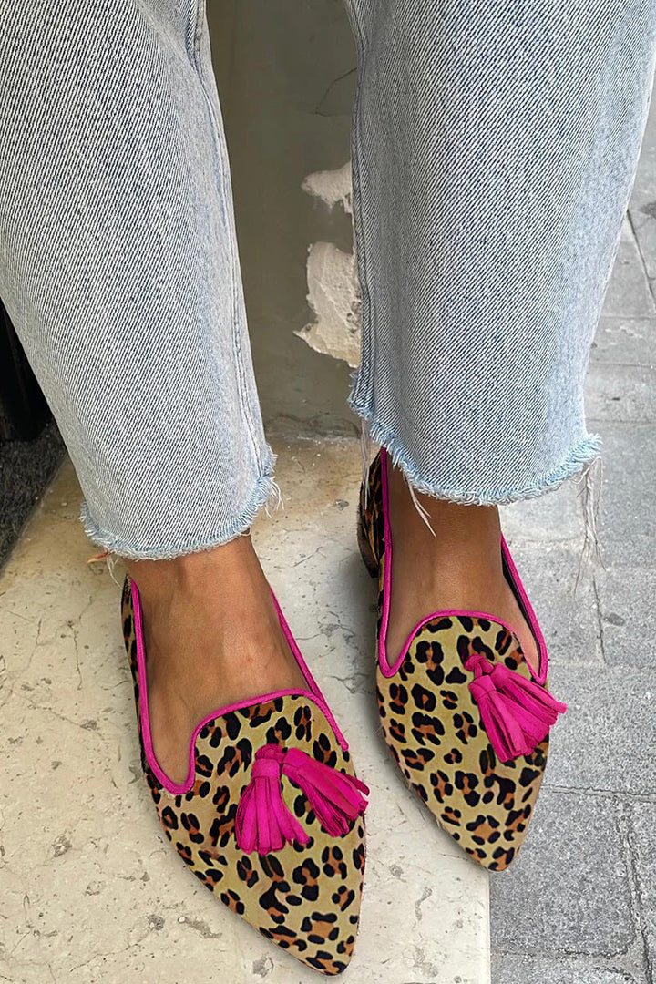 Women's stylish leopard print flat shoes. Fashionable animal print loafers, perfect for comfortable everyday casual wear.