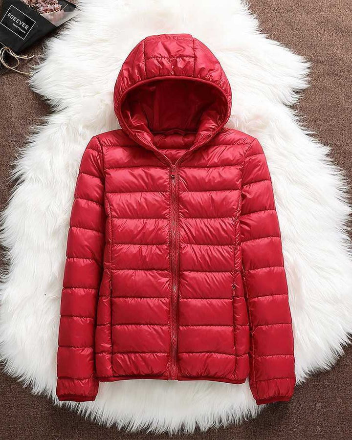Warm women's lightweight waterproof jacket. Comfortable all-weather outerwear coat for rain protection & style.