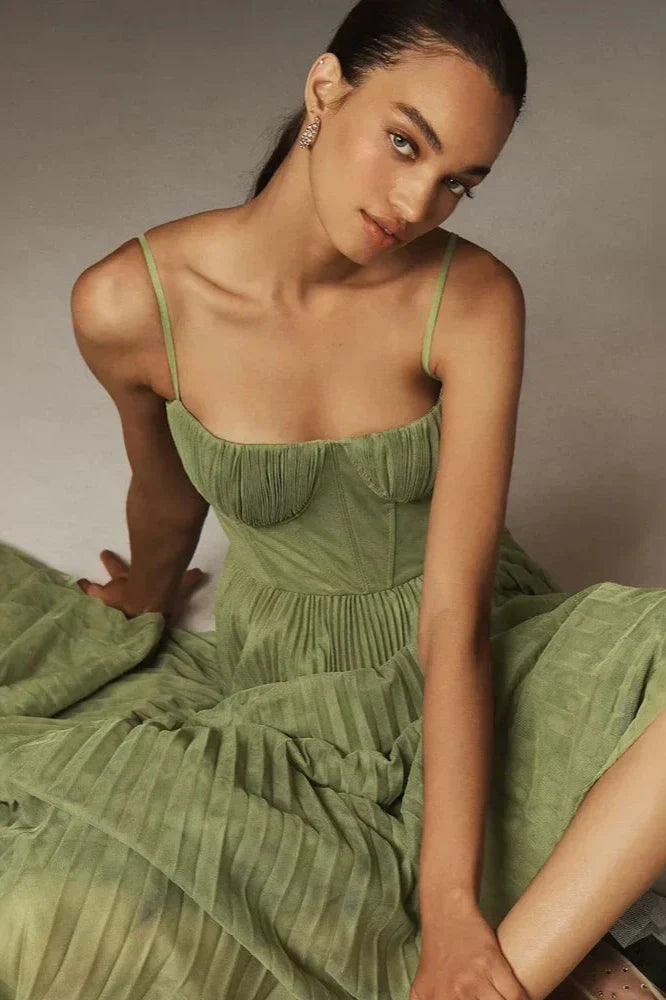 Luxurious women's elegant green pleated tulle midi dress with delicate pleats. Ideal for evening or formal events.