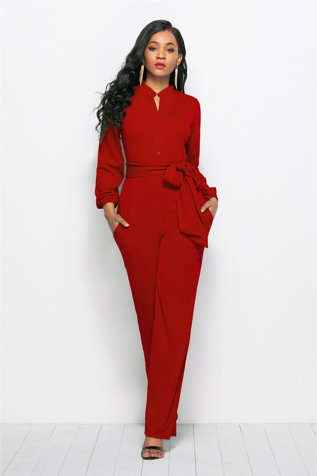 Modern women's formal jumpsuit with tailored long sleeves, a chic one-piece for contemporary fashion.