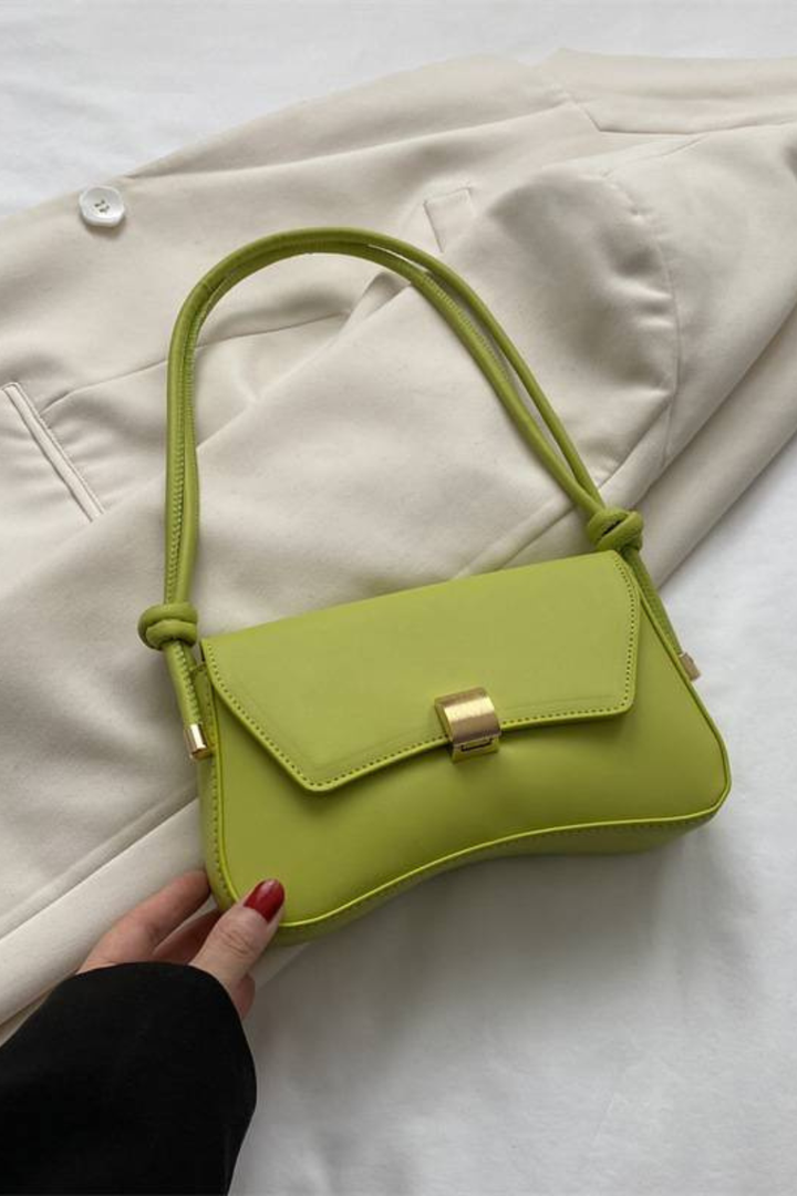 Chic women's minimalist shoulder flap bag with a distinctive gold clasp, available in multiple colors.