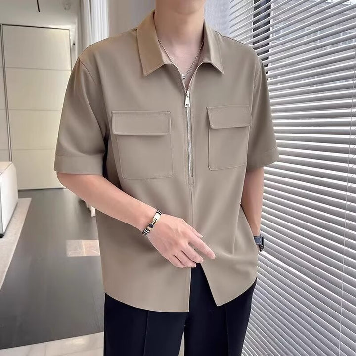 Relaxed fit men's casual short sleeve zip-up top, great for everyday activities and modern men's fashion.