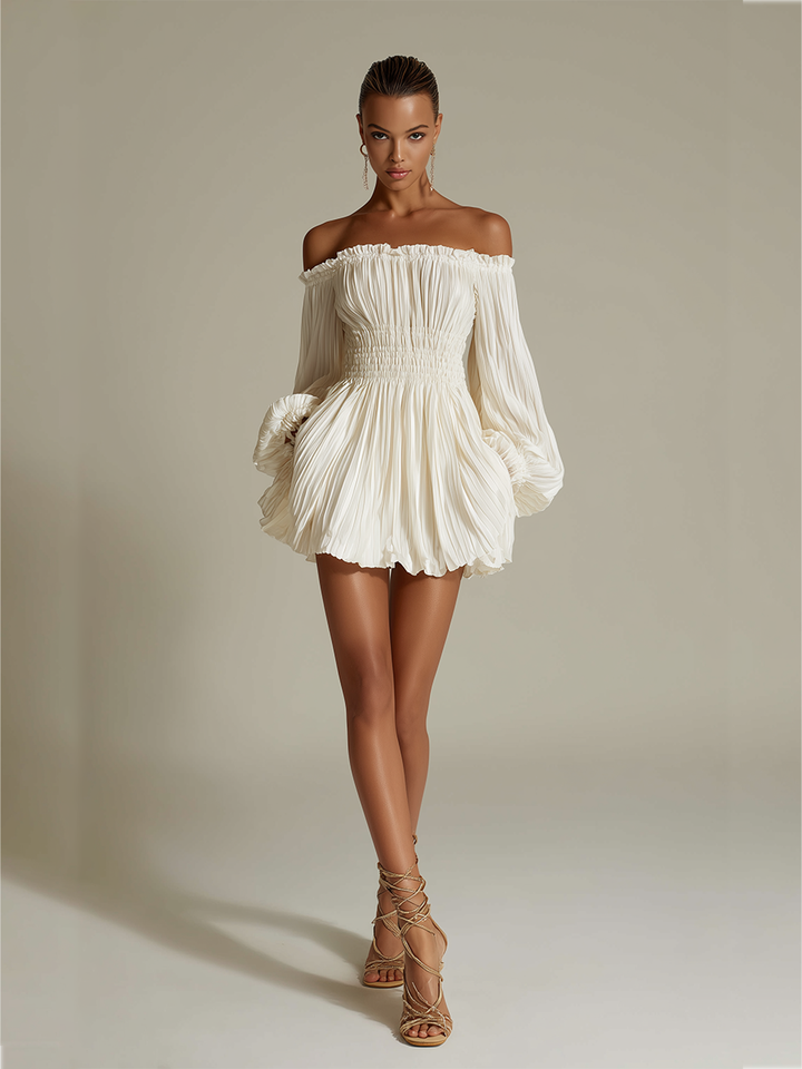 Chic ivory Bardot mini dress for women, featuring a flattering pleated skirt, ideal for cocktails & events.