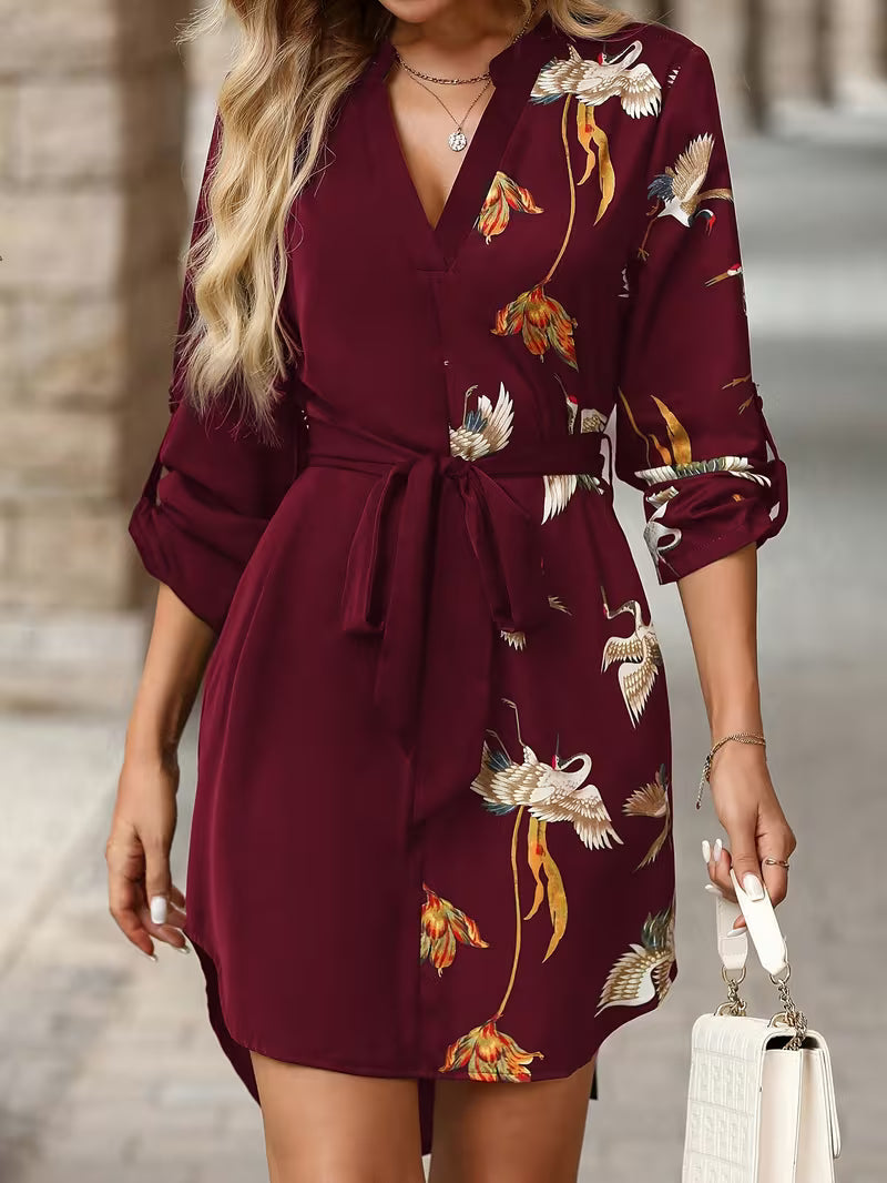Versatile women's floral wrap mini dress, ideal for summer. Features a chic tie waist and vibrant print.