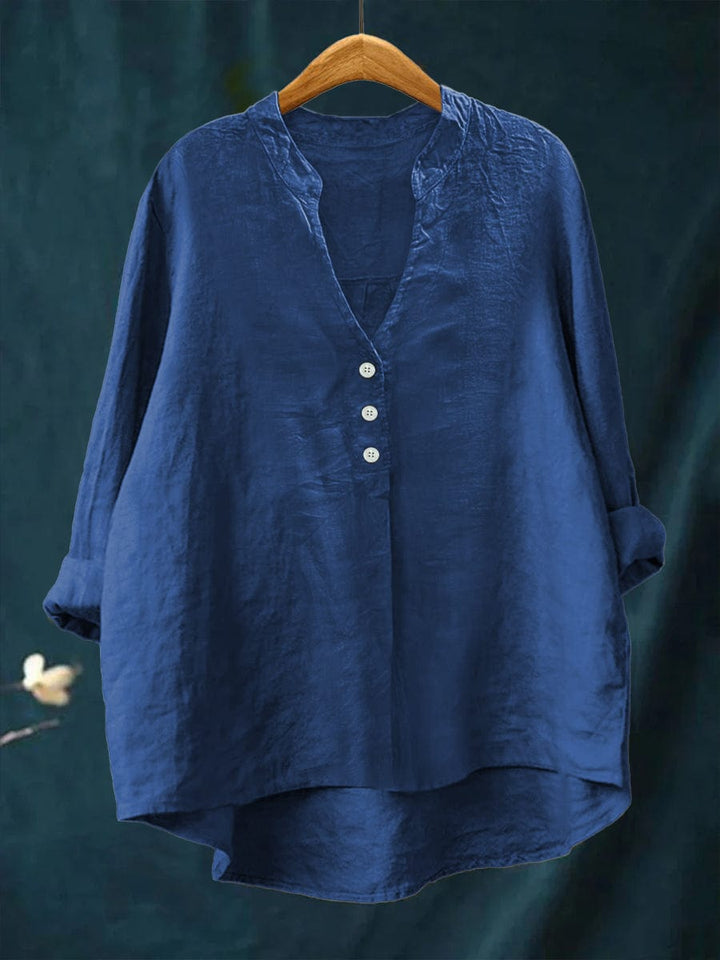 Casual women's button-front blouse with stylish high-low hem. Relaxed fit top, perfect for versatile spring and summer fashion.
