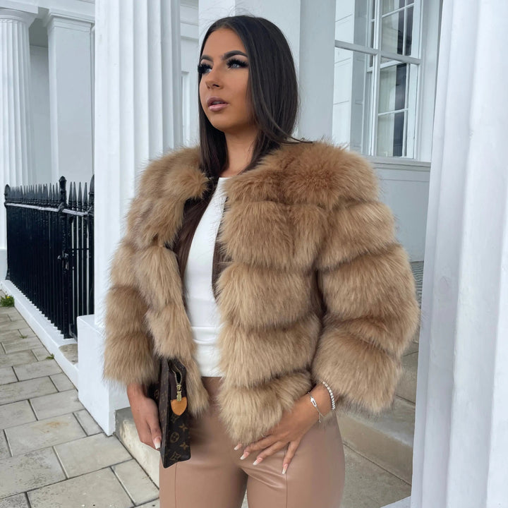 Model wearing a stylish women's winter coat, elegant outerwear for cold weather fashion.