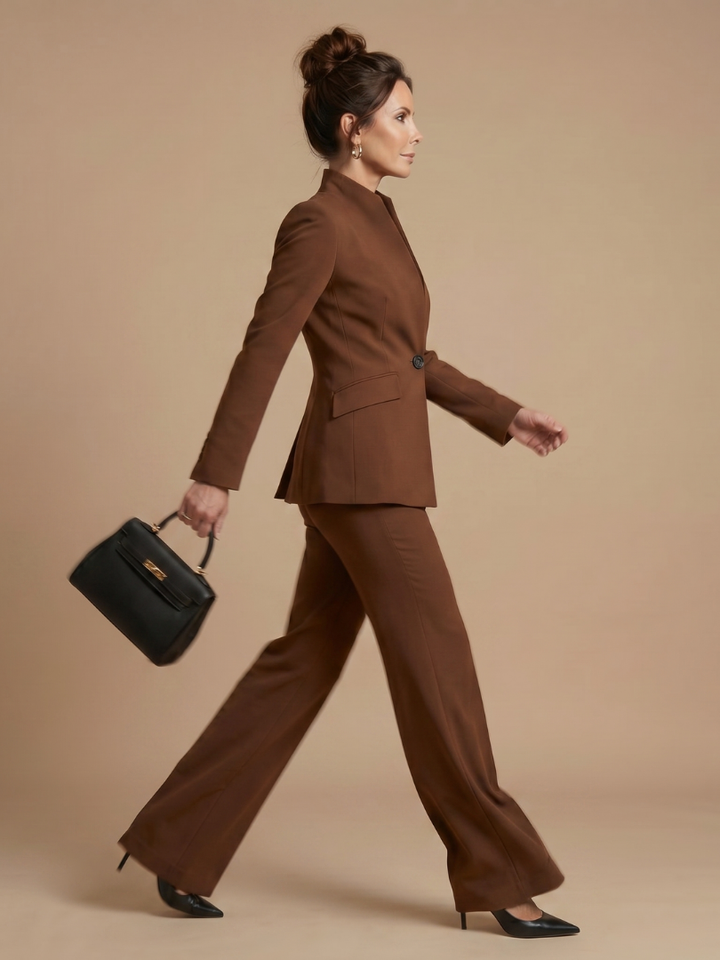 Women's professional two-piece suit: structured stand collar jacket and tailored flared trousers.