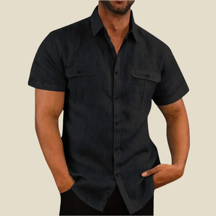 Men's relaxed fit short-sleeve button-down shirt with dual chest pockets, perfect for casual summer wear.
