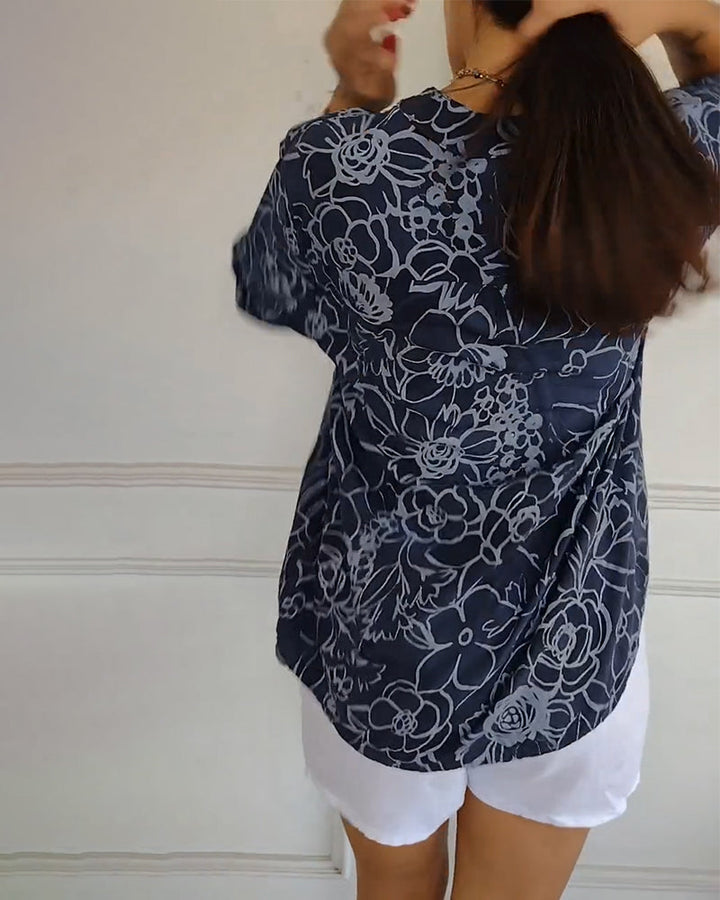 Full length view of women's elegant floral blouse with a relaxed fit, ideal for versatile wear.