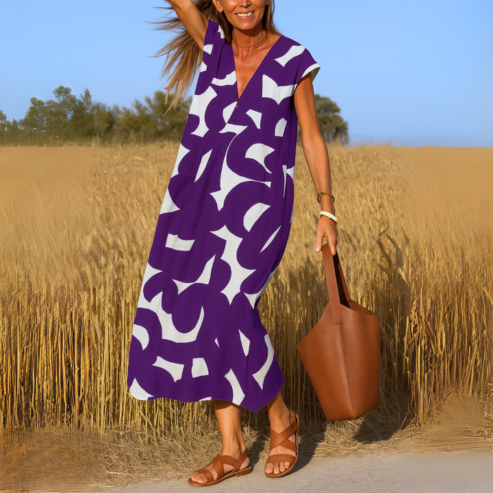 Flattering V-neck dress for women, featuring a lightweight, flowy design. Perfect for everyday comfort & style.