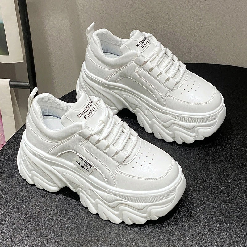 White women's chunky sneakers, comfortable platform design for a stylish and modern casual look.