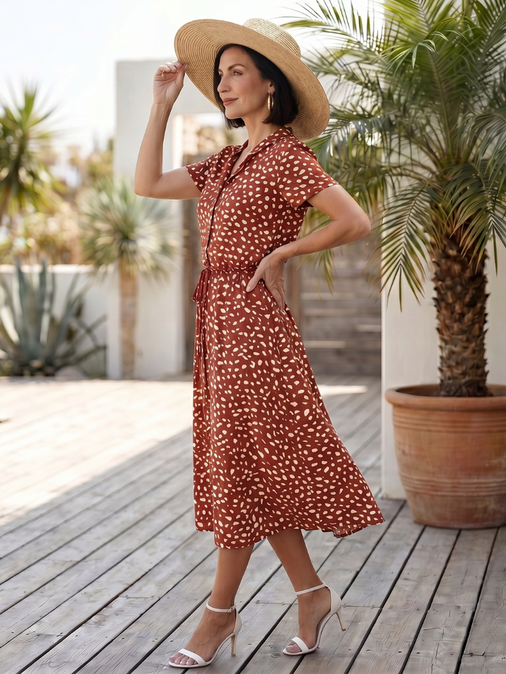 Back view of a women's casual printed midi dress, highlighting the relaxed fit and versatile summer fashion.