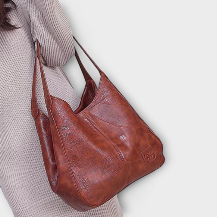 Elegant women's vintage leather shoulder bag, versatile handbag for daily essentials.