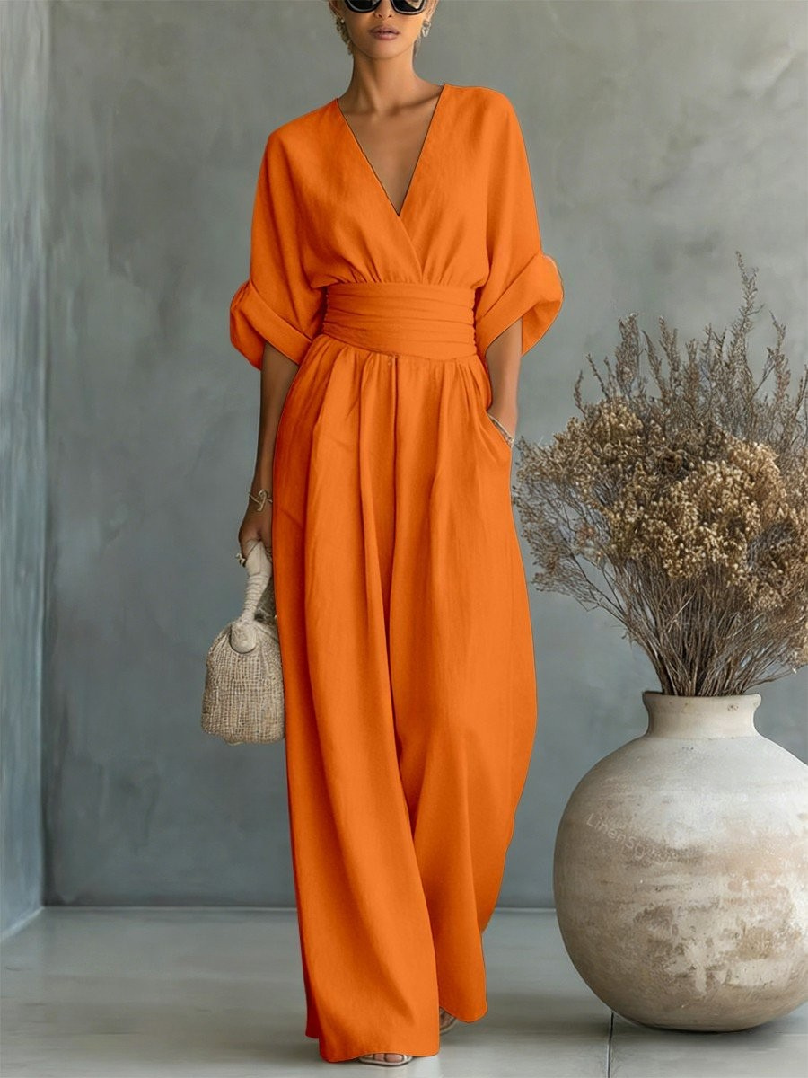 Professional V-neck women's jumpsuit, stylish for the office and elegant for evening occasions.