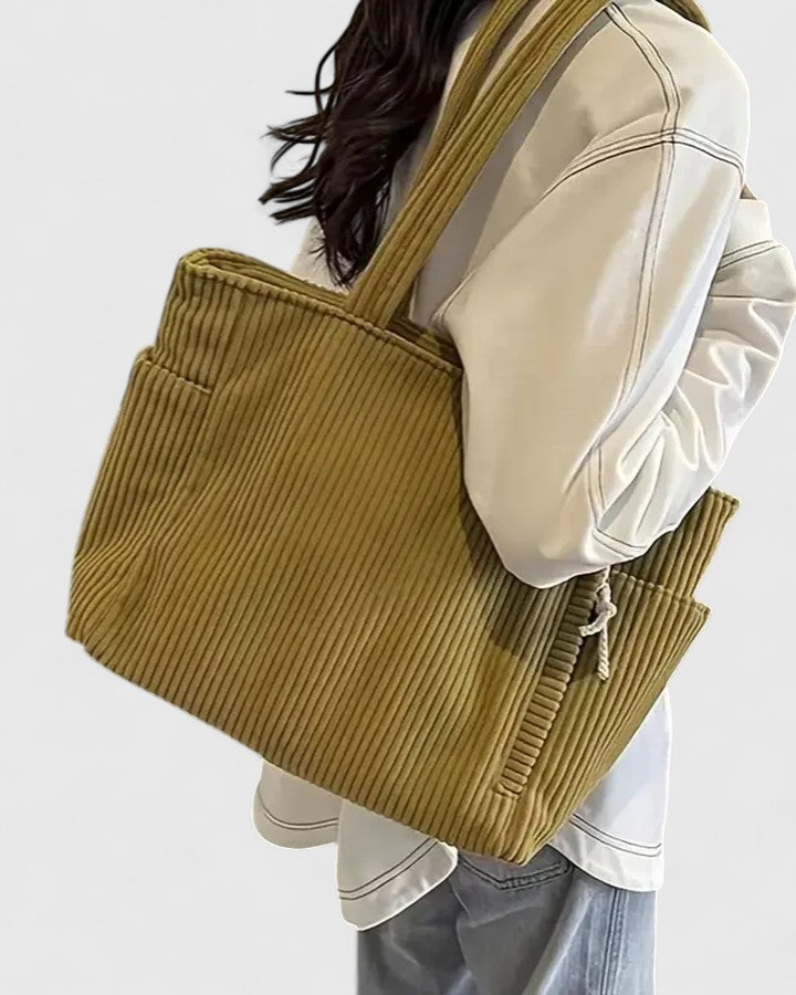 Modern women's corduroy tote, designed as a stylish and practical everyday shoulder bag.