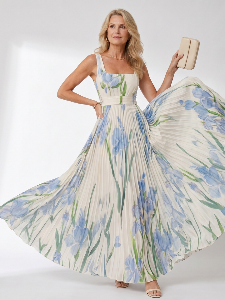 Detail shot of the graceful pleats on this women's sleeveless square neck midi dress. Day wear elegance.
