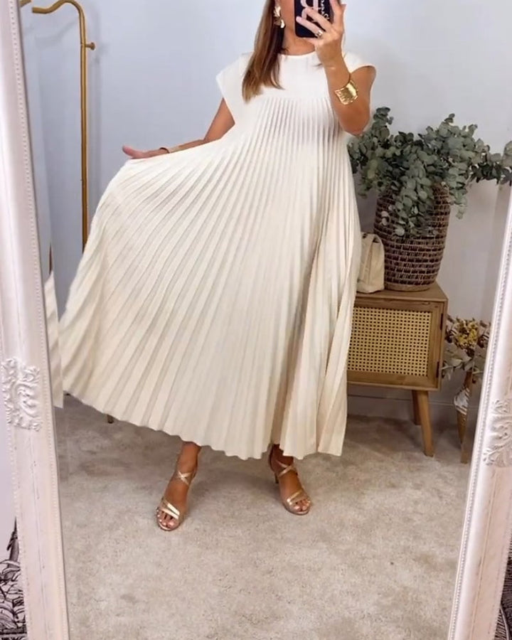 Elegant women's dress with timeless pleats. Perfect comfort for versatile styling.