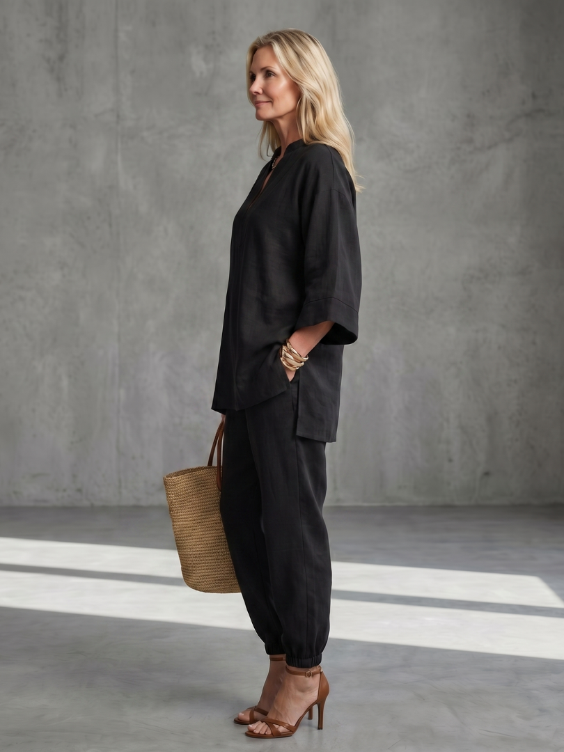 Stylish women's summer set: relaxed V-neck tunic, wide sleeves, & gathered trousers.