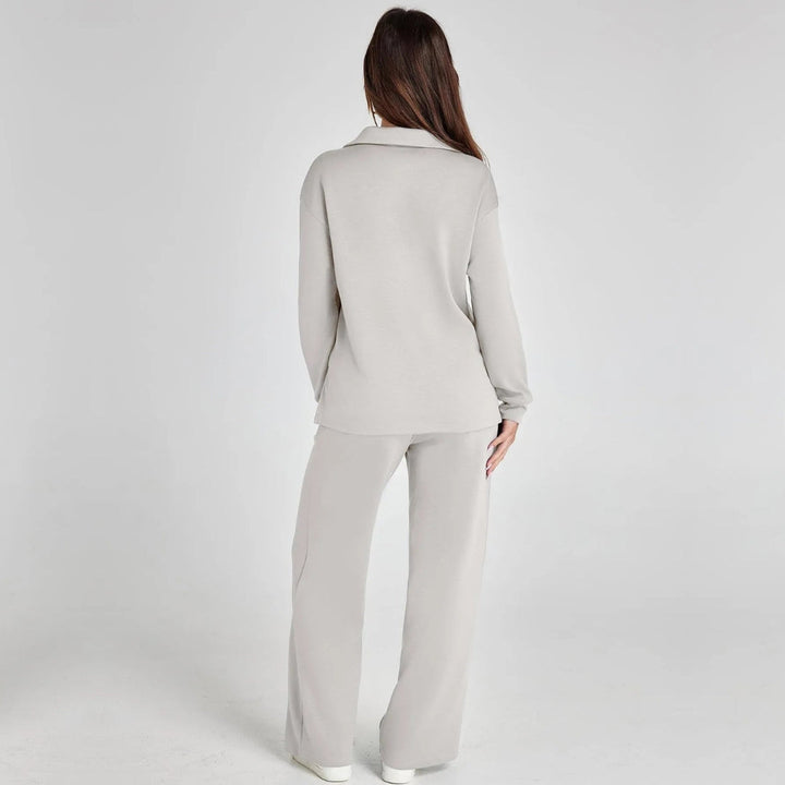 Women's relaxed fit loungewear set with V-neck long sleeve top and wide leg trousers. Cozy.