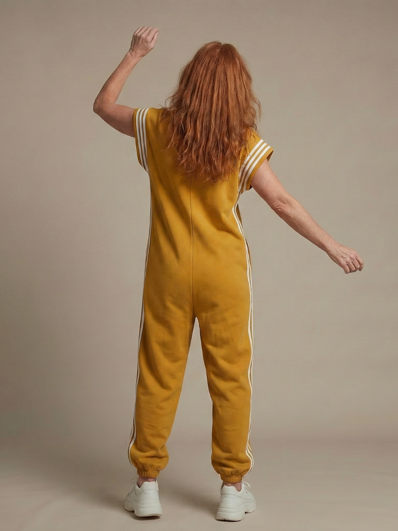 Chic women's stripe panel jumpsuit with a high neckline and zip front closure. Versatile style.