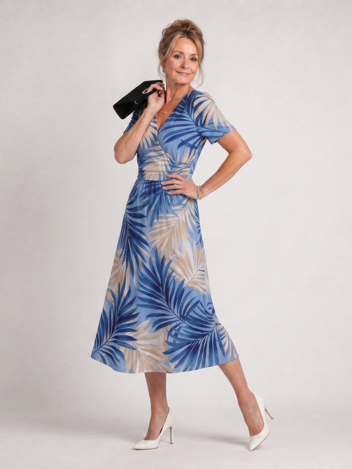 Pretty floral print short sleeve midi dress for women. V-neck design, perfect as a flowy summer casual dress.