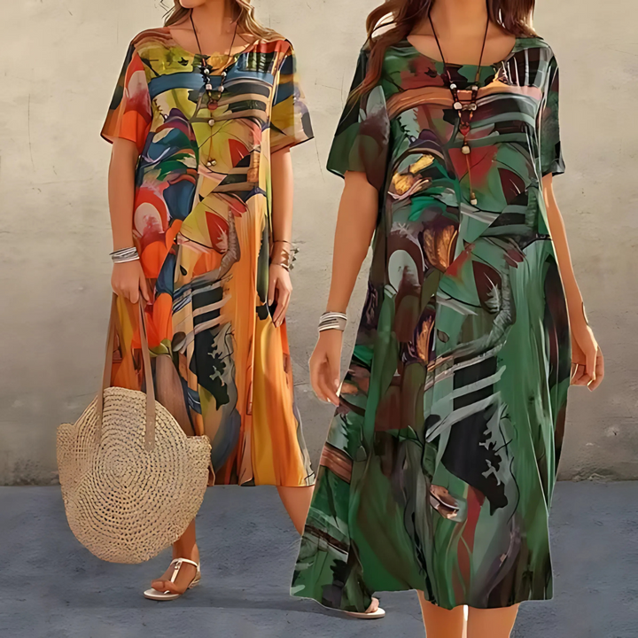 Women's elegant midi dress in a bold abstract print. Flowy short sleeve design, ideal for summer fashion.