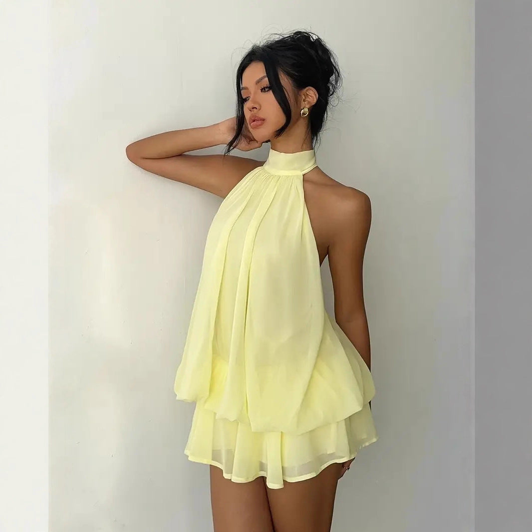 Fashionable women's sleeveless tiered ruffle mini dress with a comfortable halter neck for daily wear.