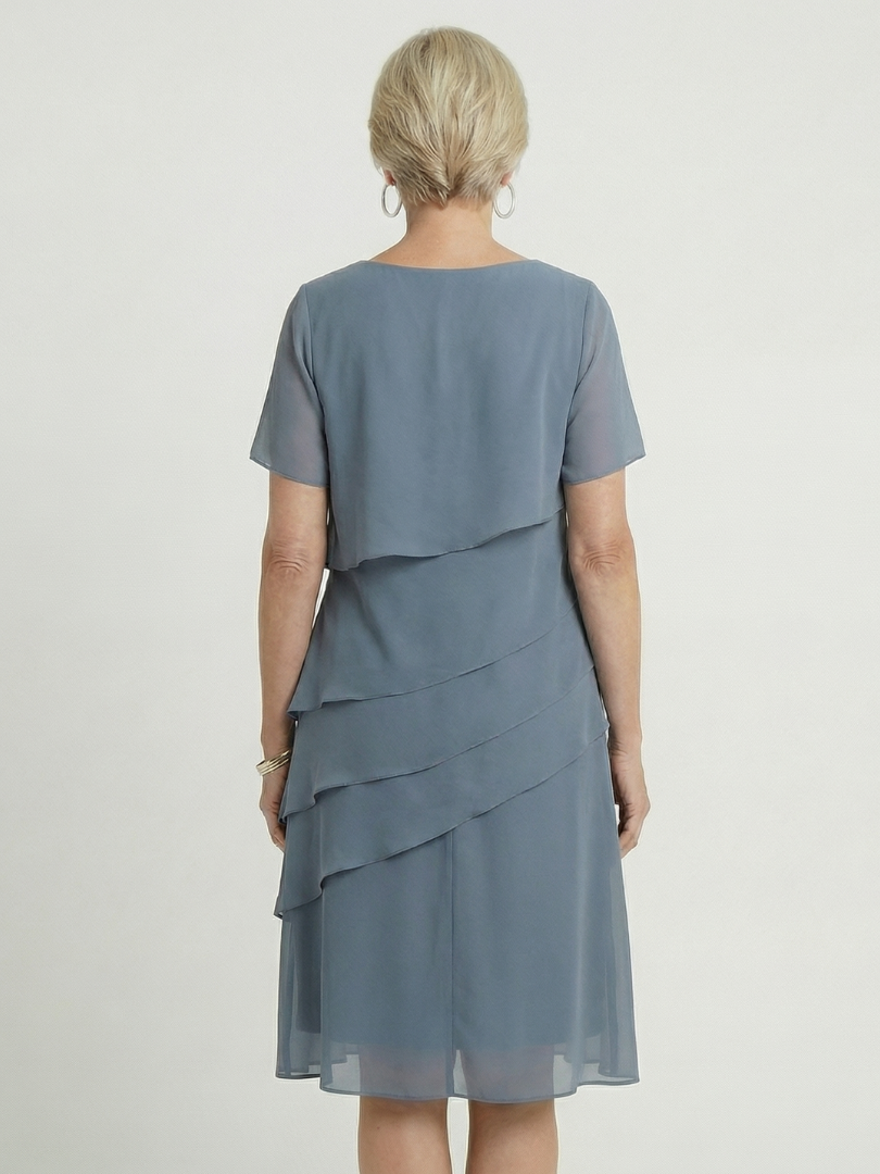 Women's short-sleeve knee-length dress, soft contour design for comfortable and versatile styling.