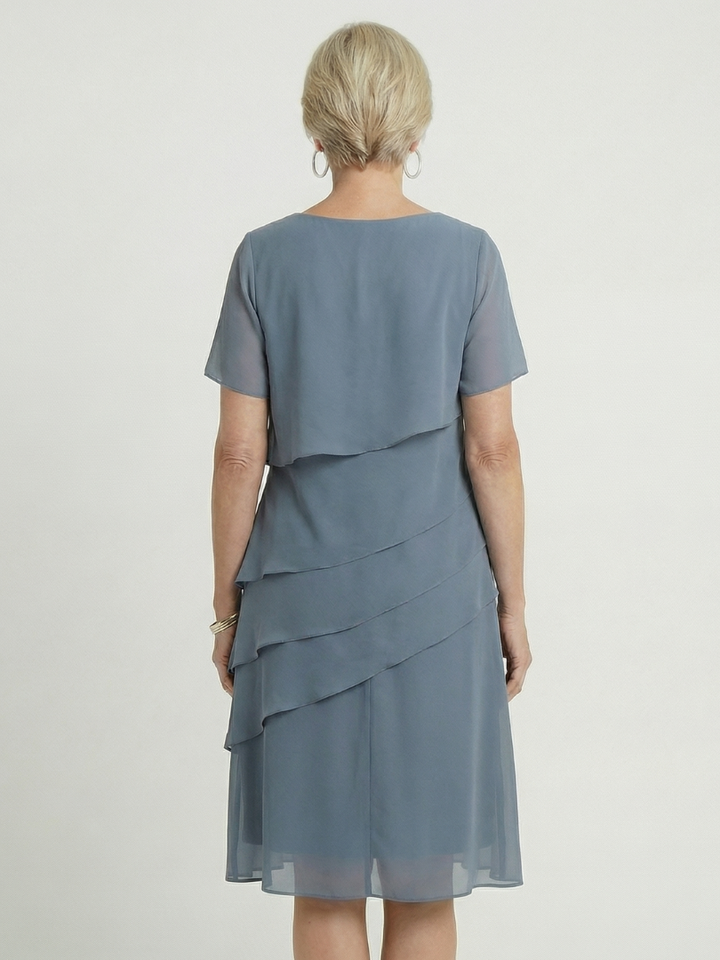Women's short-sleeve knee-length dress, soft contour design for comfortable and versatile styling.