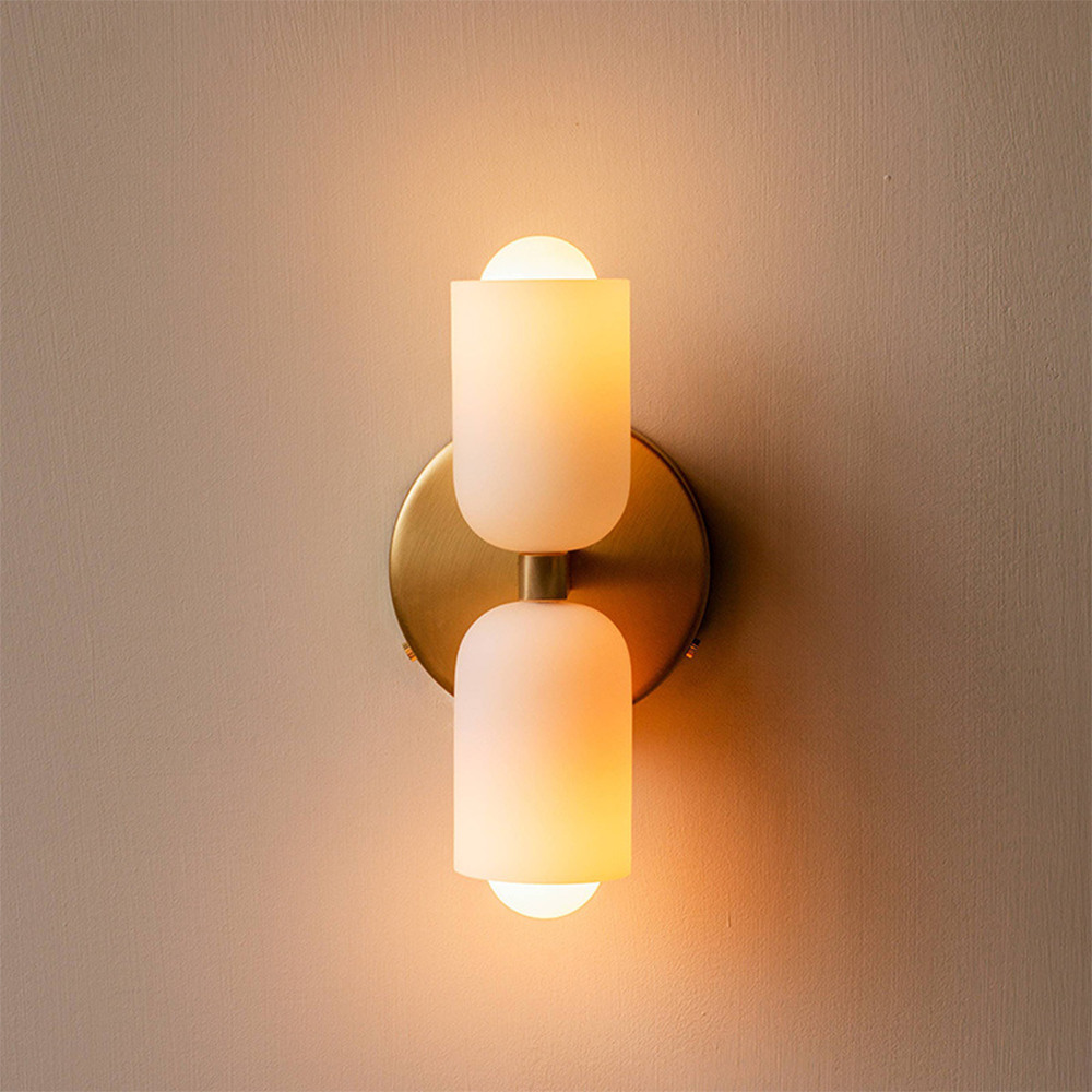Contemporary wall lamp with uplight and downlight effect for elegant home decor.
