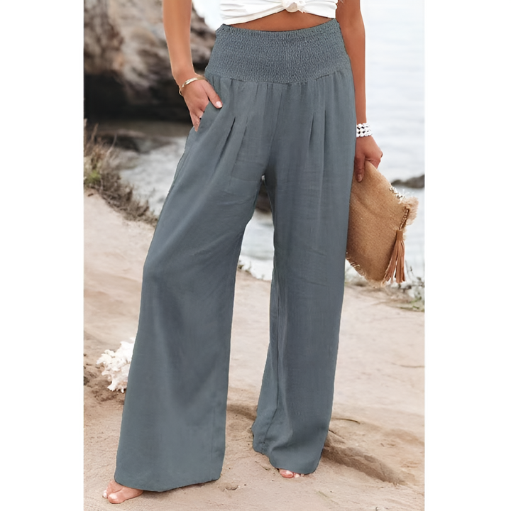 Relaxed fit high-waisted women's trousers, offering effortless style and comfortable wear for any occasion.