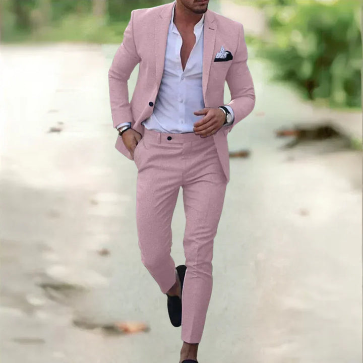 Stylish woman posing in a luxurious two-piece suit set. Elegant blazer and pants for versatile formal wear.