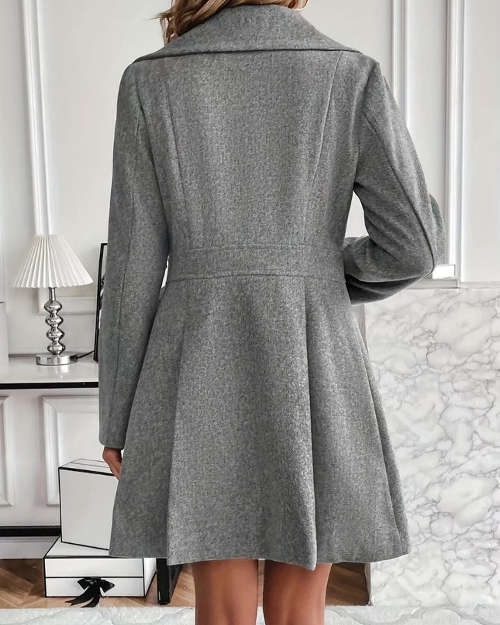 Formal women's elegant pleated longline winter coat, perfect for dressy occasions & stylish outerwear.