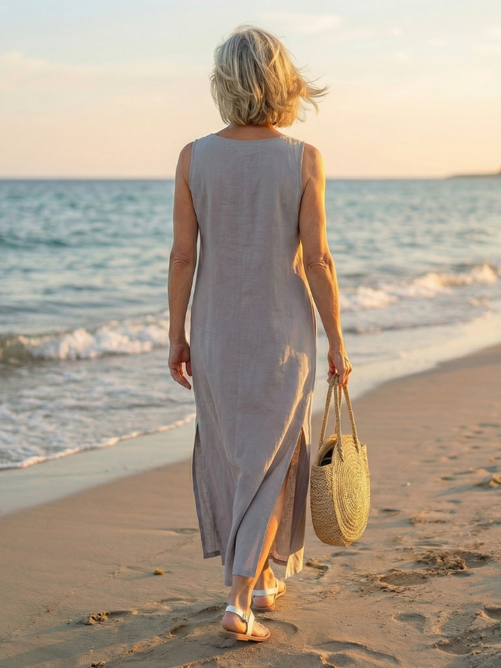Relaxed fit sky blue midi dress for women, sleeveless, flowy, and embroidered. Perfect summer travel wear.