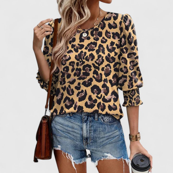 Women's versatile smocked top, an elegant blouse for both casual and dressier spring looks.