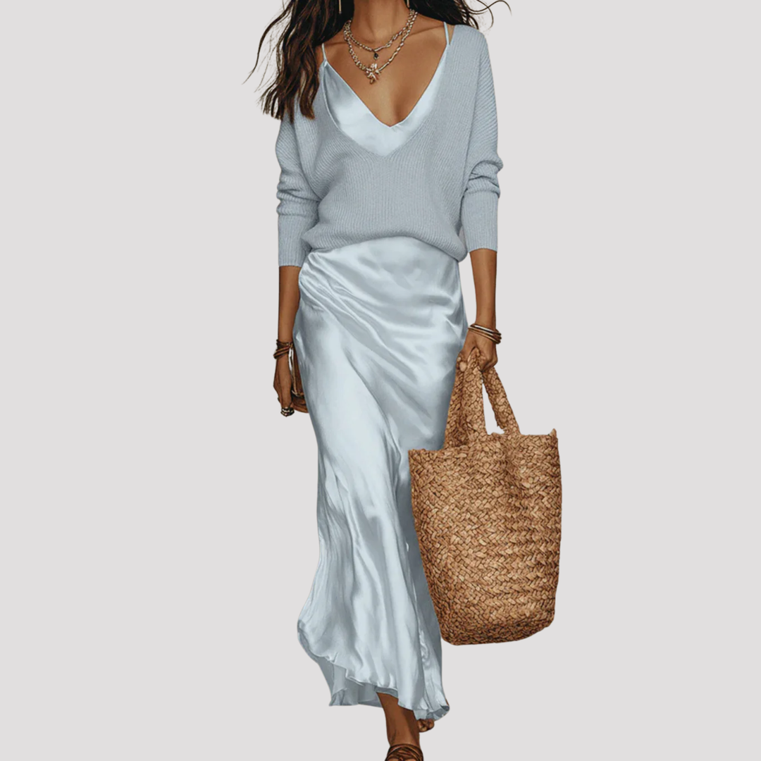 Woman in an elegant V-neck layered maxi dress. Long sleeve design, perfect for versatile casual to formal modern style.
