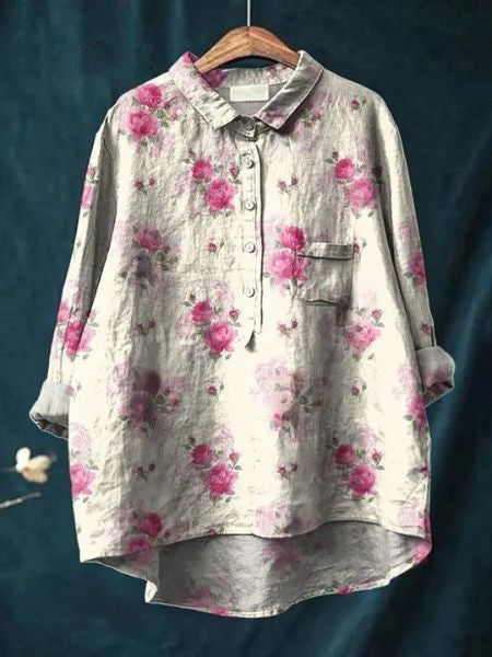 Full view of a women's floral button-up blouse, great for spring & summer fashion, casual or elegant.