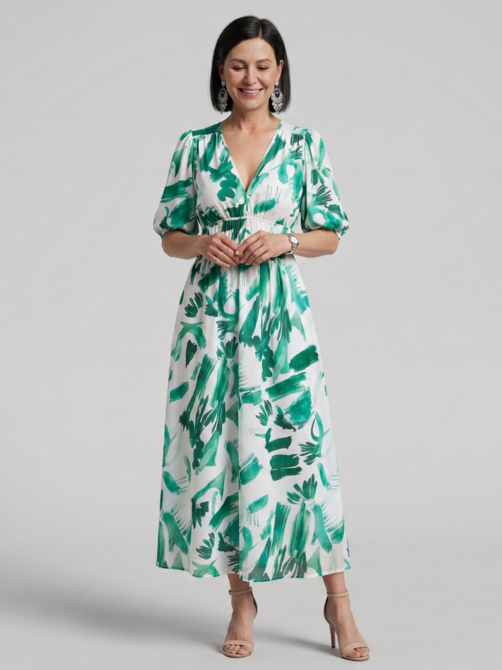 Side profile of a woman in the abstract print puff sleeve midi dress, a chic V-neck spring/summer outfit.