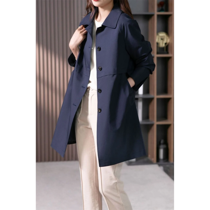 Fashionable women's long trench coat, classic design with an elegant tied waist for versatile wear.