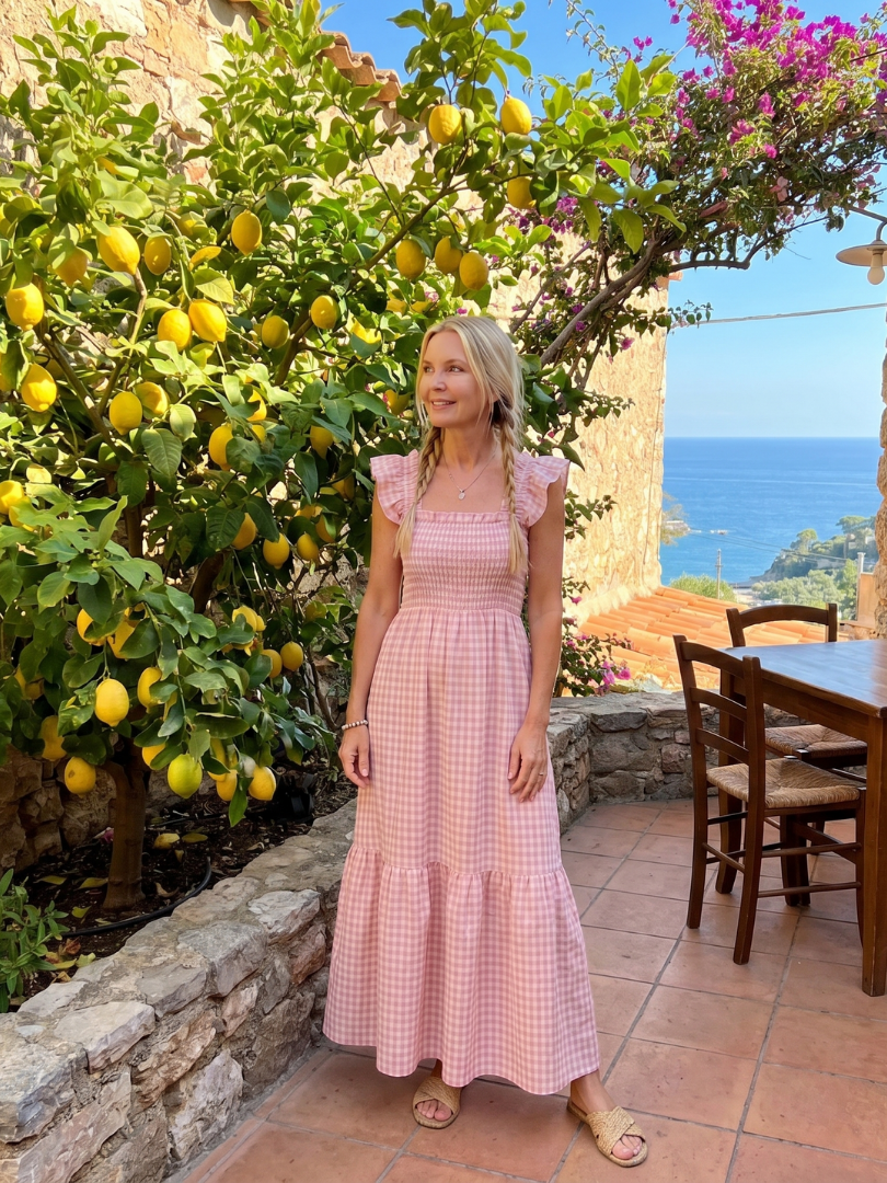 Chic sleeveless women's gingham midi dress, featuring an elegant square neckline for warm weather.